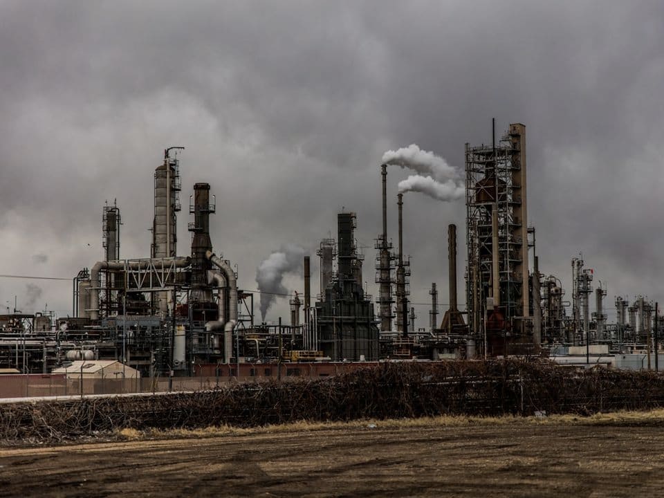 A refinery working under a moody sky